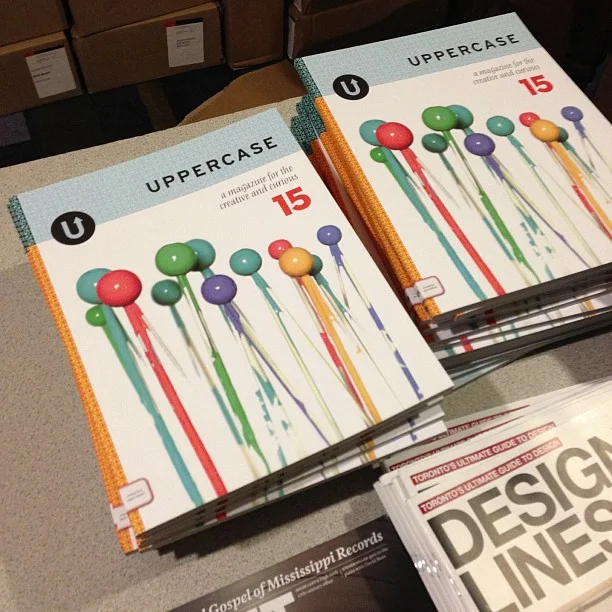 Piles of complimentary magazines including UPPERCASE, Design Lines and Applied Arts.
