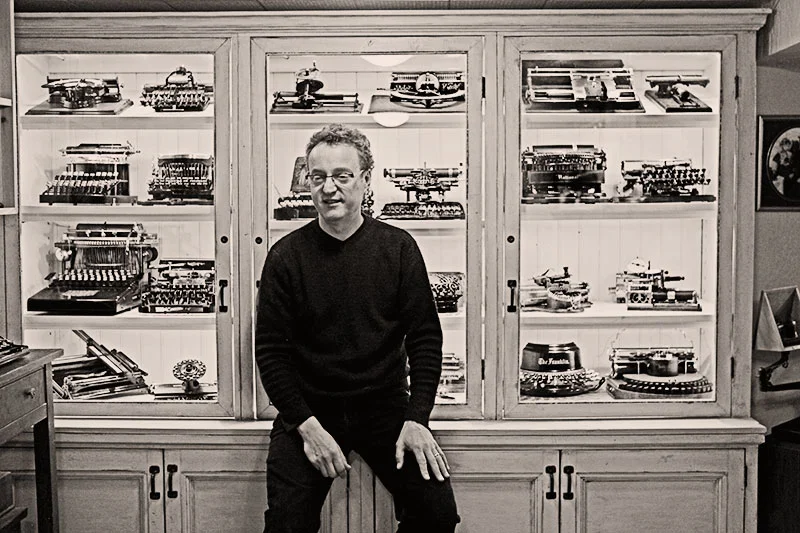 Martin Howard and his collection of early typewriters.