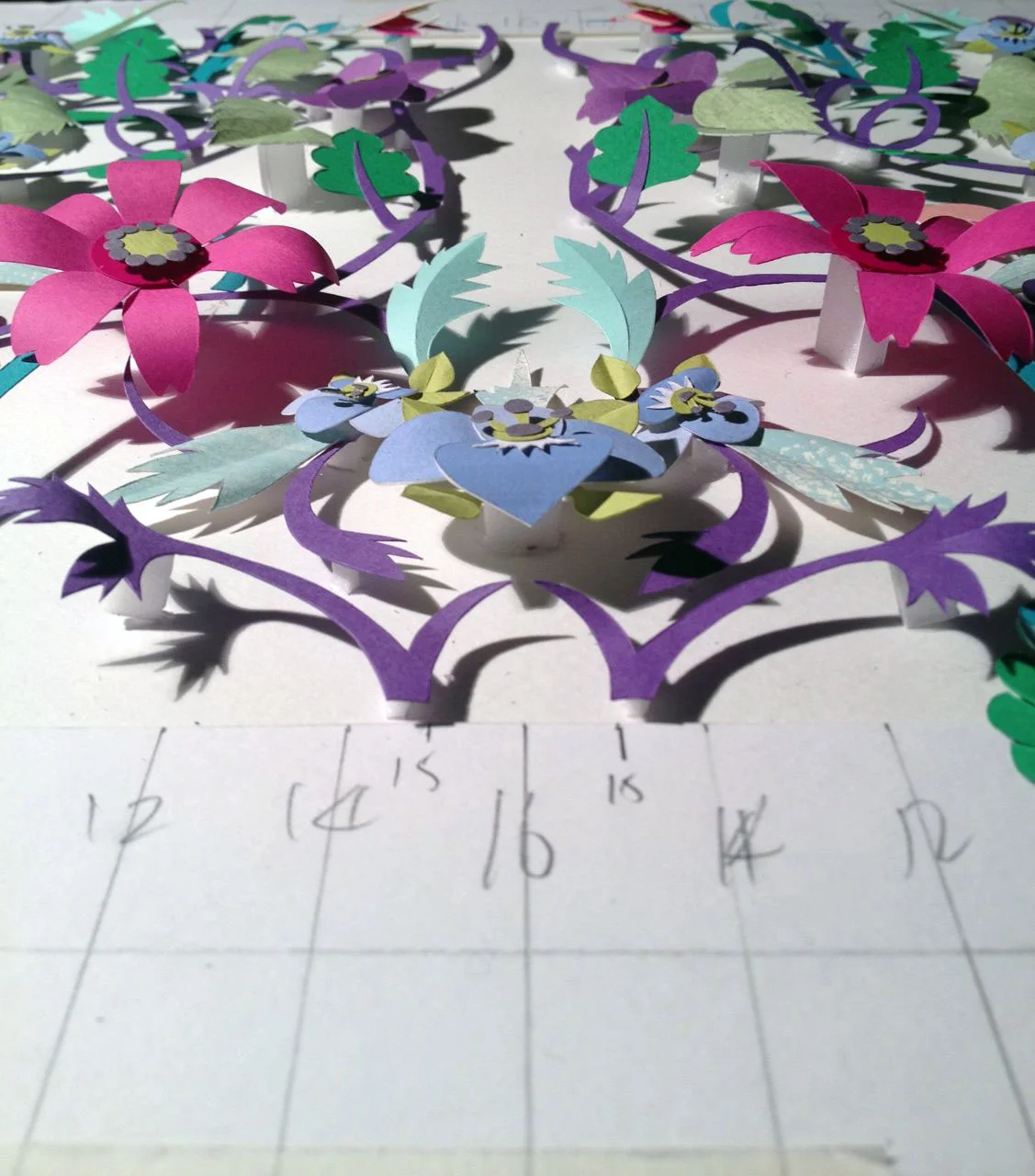 I then made up a pencil grid and cut out all the pieces working out the layer and levels of pattern.