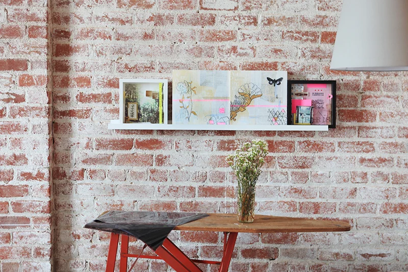 Creativebug has a set room dedicated to shooting videos. Courtney Cerruti (below) styles the room to suit each instructor. The shadowbox collages on the wall are ones that she made during her own how-to session.