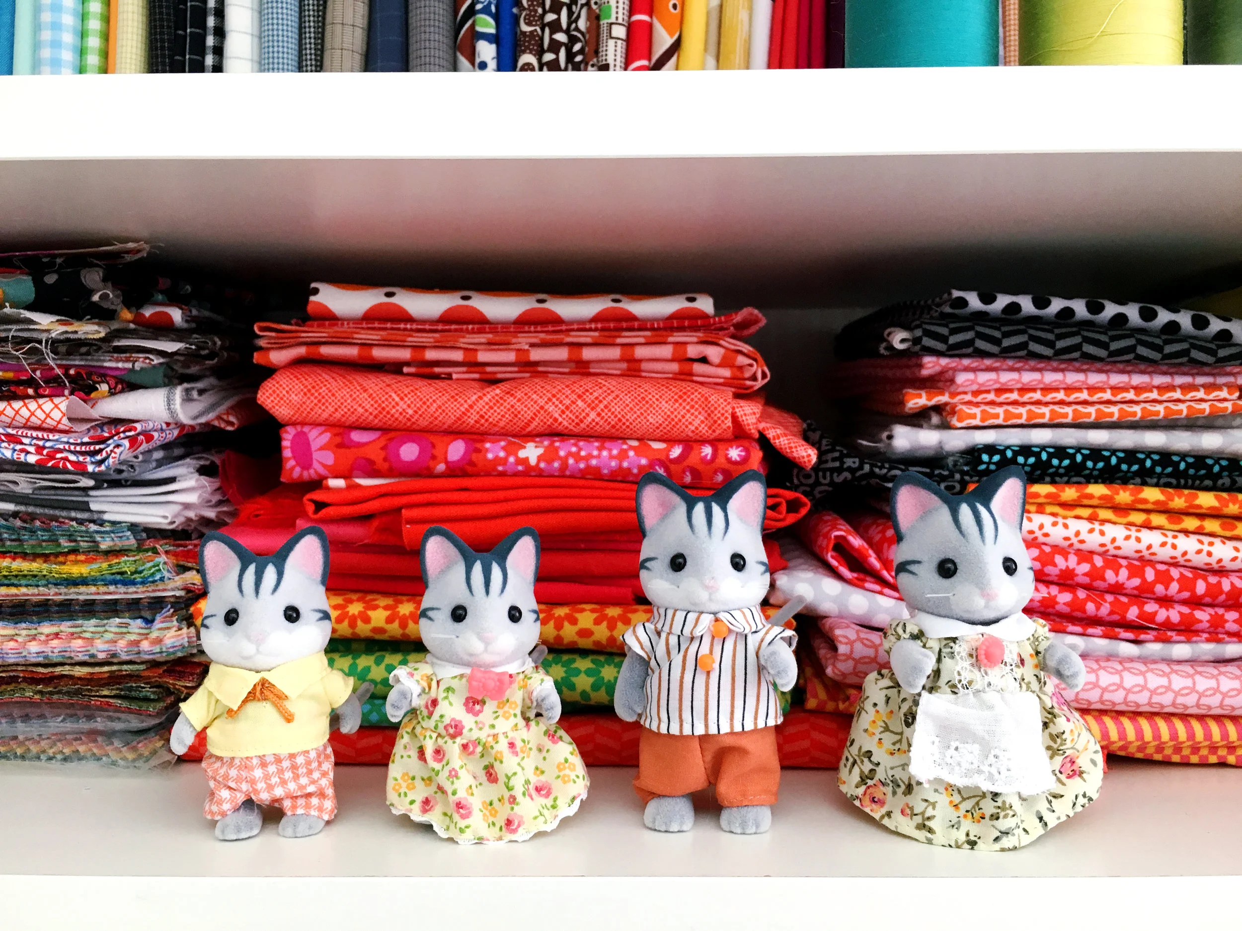I've always wanted a family of calico cats. Thanks to Glen and Finley and their Christmas gift, I have these little guys to play with. I'd like to sew them clothing in my fabric and vintage feed sack scraps.