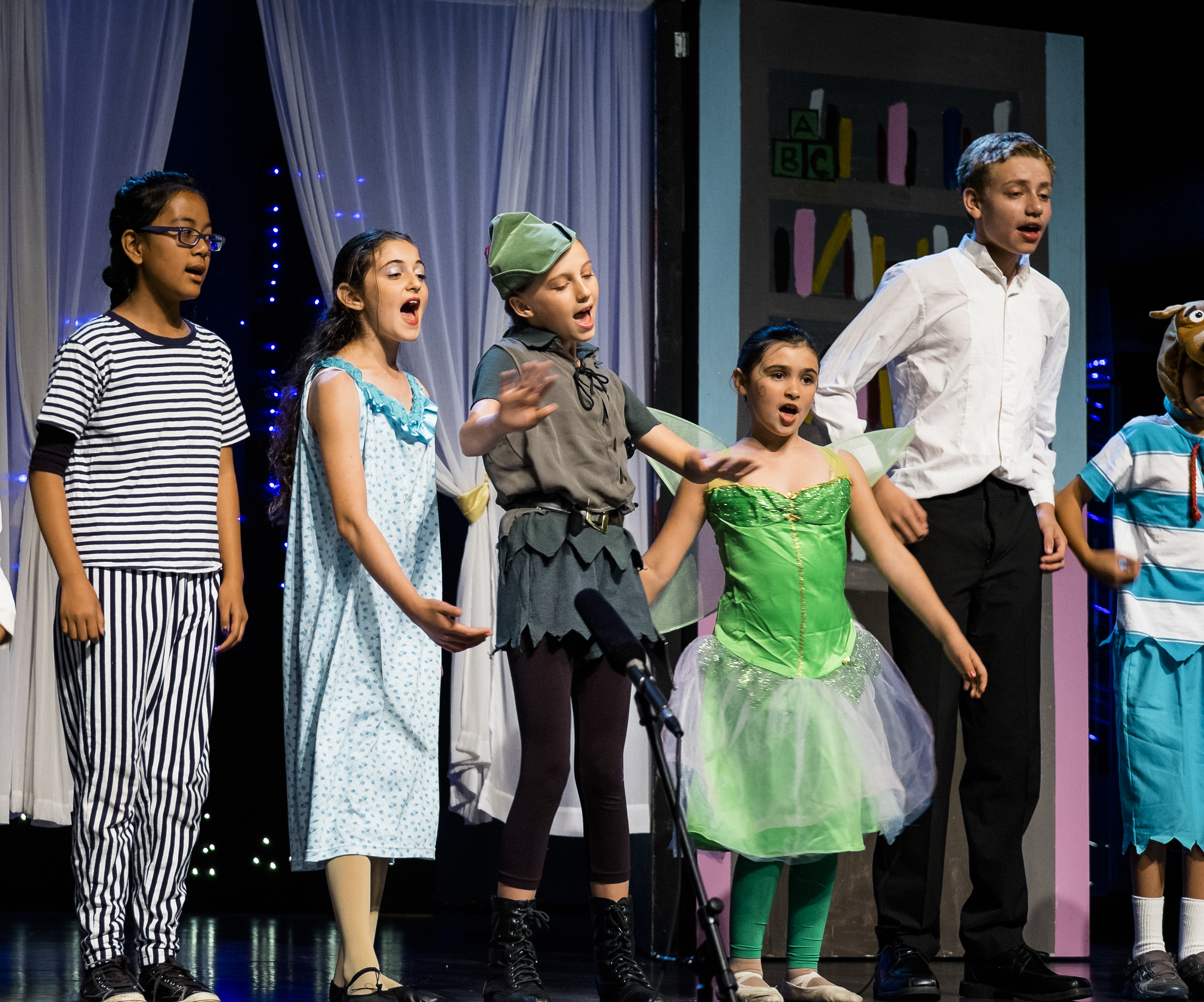 Really, the reason I bought it. My older daughter starring in Peter Pan. 1/80s, f/2.8, 140mm. ISO 800