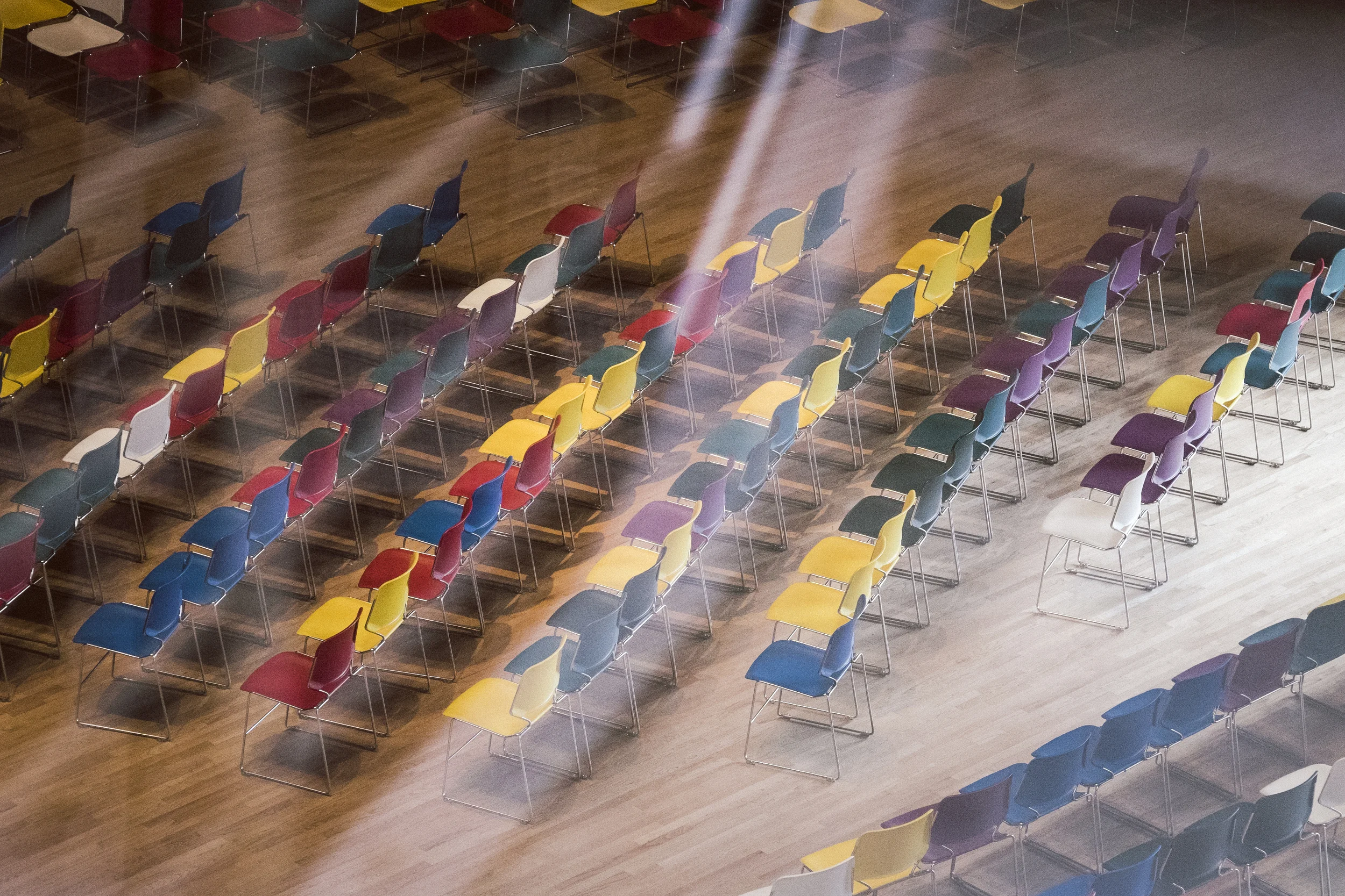 The zoom lens let me get up nice and close to these wonderful chairs. What looks like sun beams are really reflections in the window that I used to press up against to get the shot. 1/80s, f/7.1, 87mm. ISO 3200. 