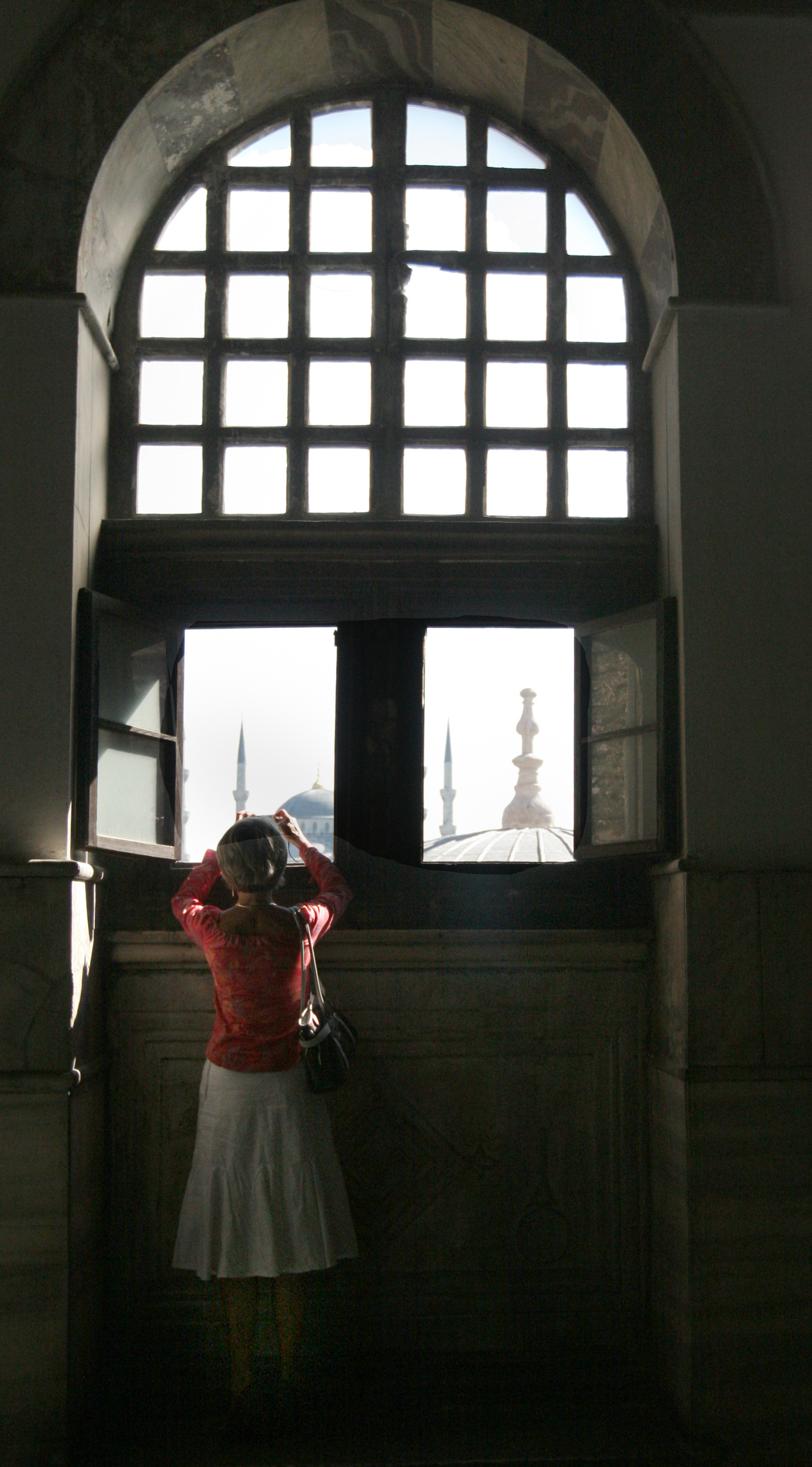 A tourist at the Hagia Sophia tries to get a photograph of downtown Istanbul’s Sultanahmet district.