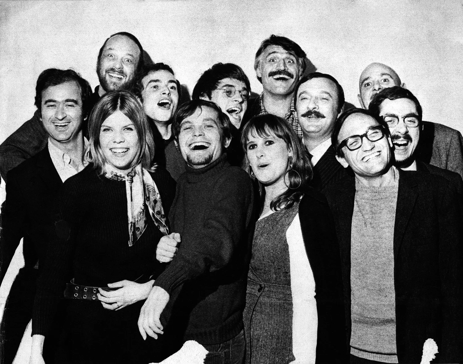 Guy Peellaert (up left) and François Cavanna (up right) pose with fellow Hara-Kiri contributors in 1968.