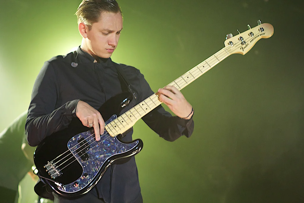 Oliver Sim slapping the bass (Photo Credit: Robert Castro) 
