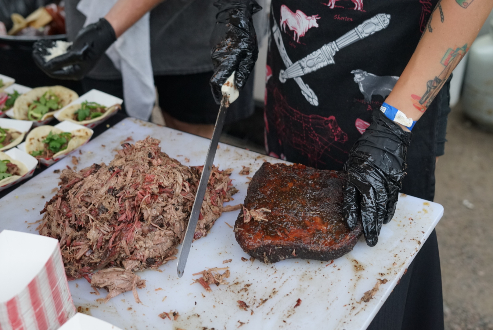 Owl Bear serving up delicious BBQ Brisket Tacos to the VIP crowd!