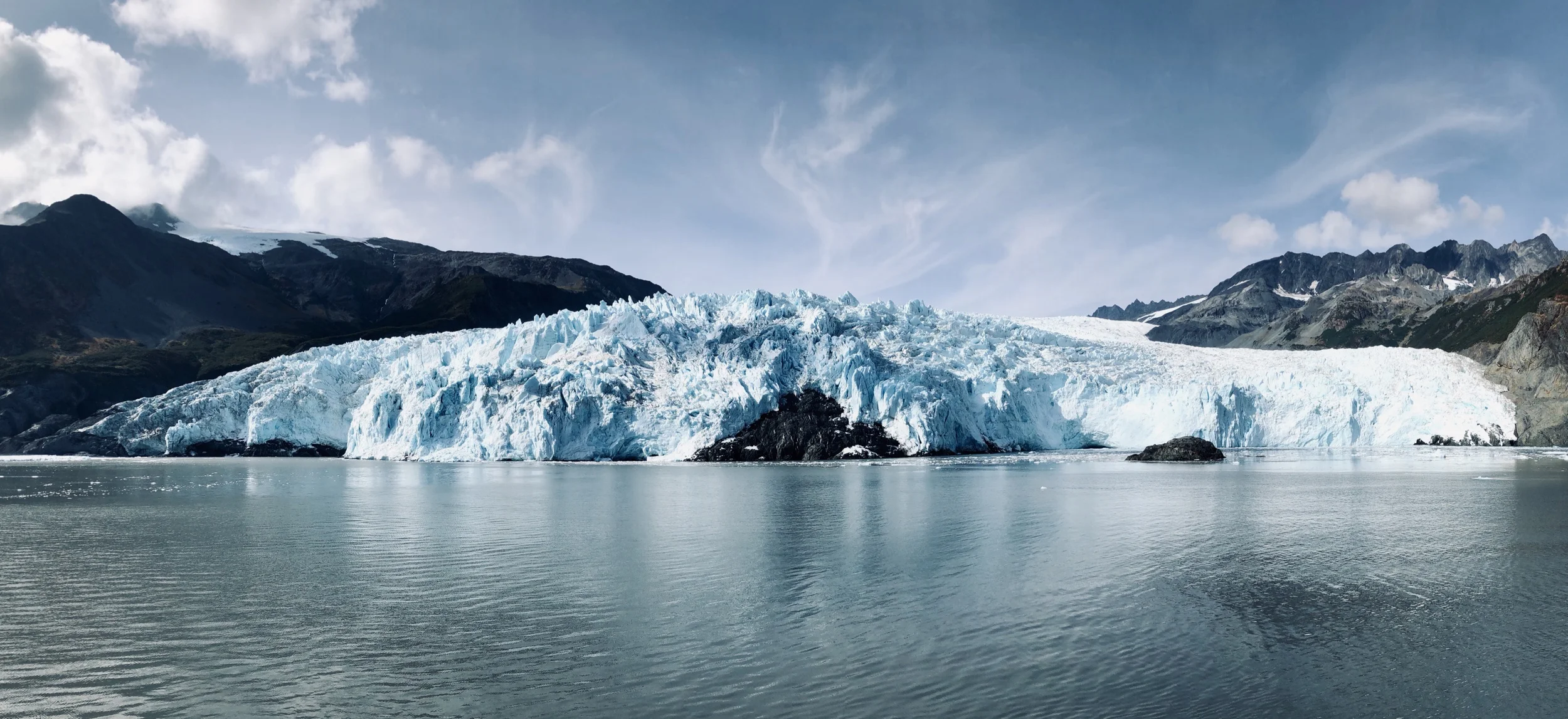 This is a super-wide angle shot. What you’re looking at is a glacier that’s about a mile wide and 800 feet tall.