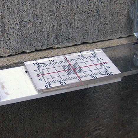 Buildera CrackMON® crack monitors add critical structural insight to a cracking crawl space. Photo ©2014 Nolan Pray. Reprinted with permission.