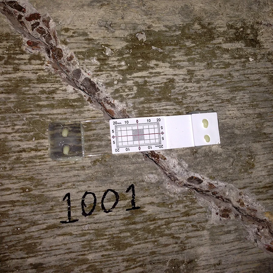 FIGURE 3. Buildera CRACKMON® 2D Crack Monitor (CLASSIC STYLE) installed with thixotropic epoxy shows no X-Y differential movement since installation, indicating relative crack stability. photo ©2014 zdx industries.