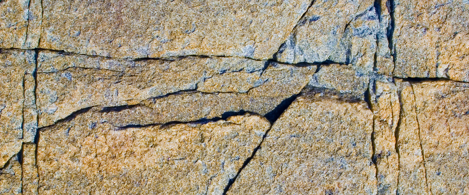 cracked-rock-wall-1500x625.jpg