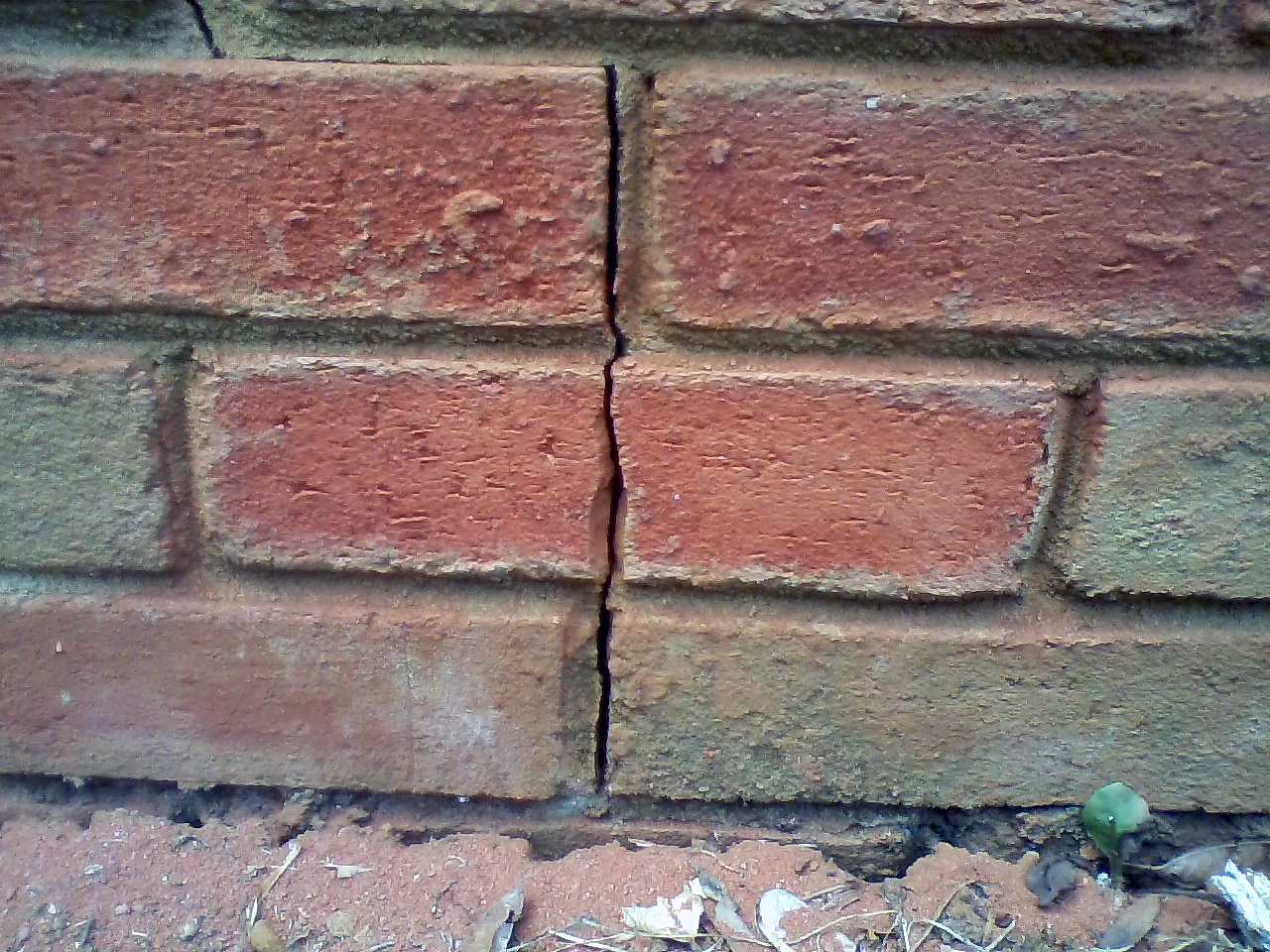 FIGURE 1. Expansion cracks from clayey soil is a likely culprit of veneer cracks.