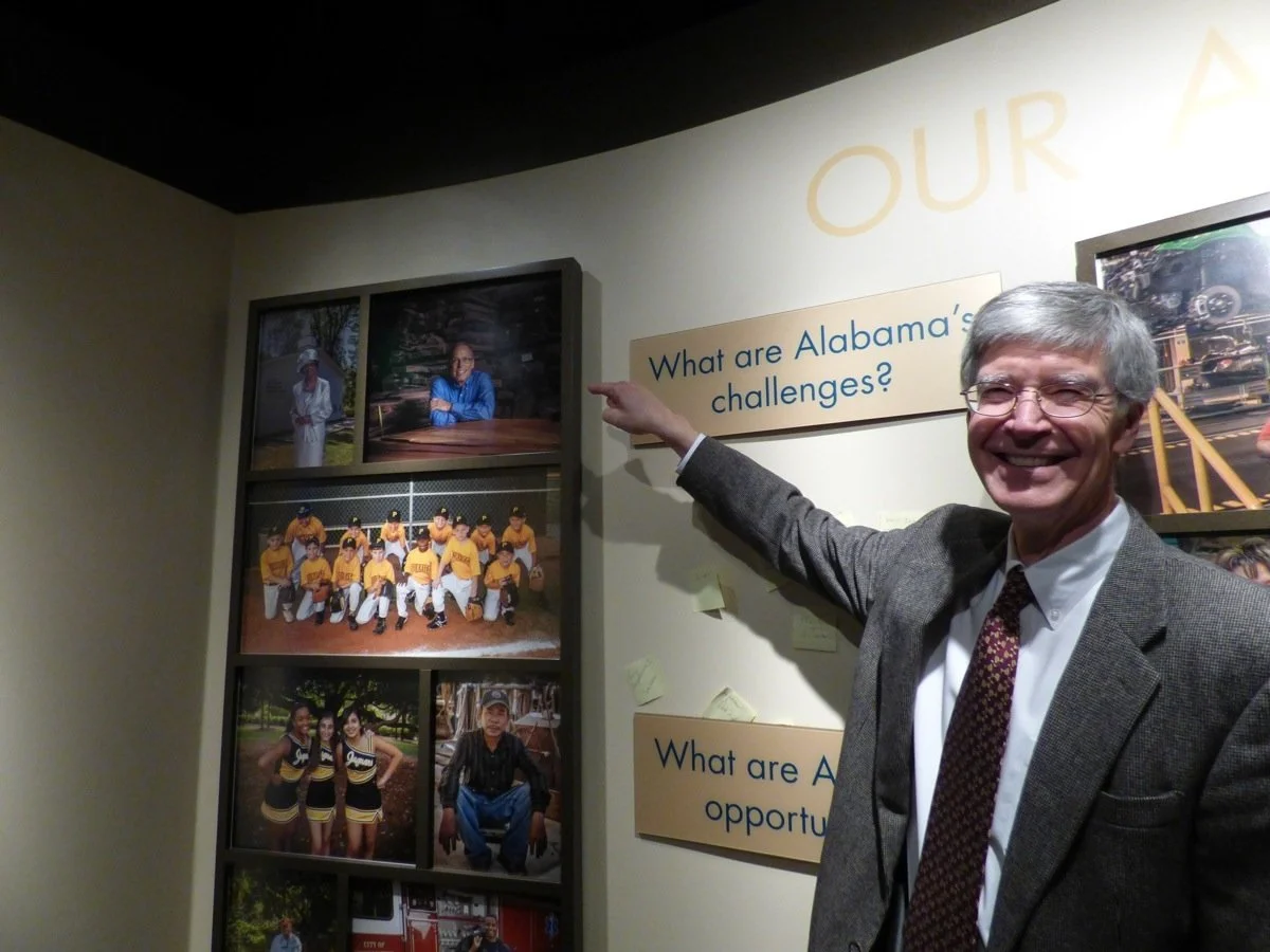 Ed Bridges Reveals a surprise.  At the Museum of Alabama, Dr Ed Bridges showed Robin his photo on the wall for the first time - right beside Rosa Parks.