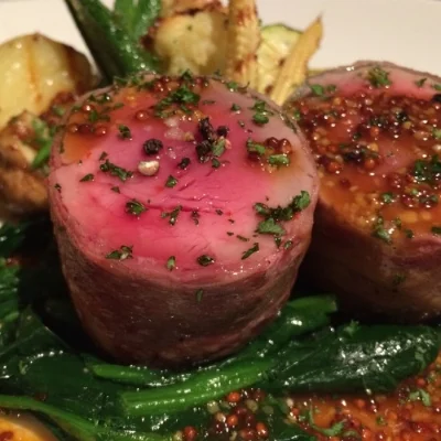 Rolled roast pork with seasonal vegetables