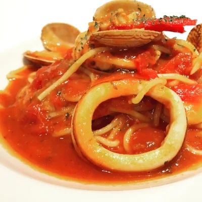 Spaghetti with squid, littleneck clams in tomato sauce