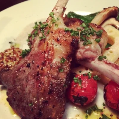 Lamb chops with lotus root and grilled tomato