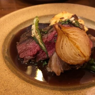 Wagyu beef shank in red wine sauce with seasonal vegetables