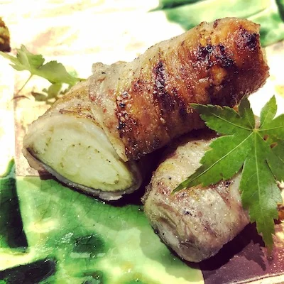 Aubergine wrapped with bacon