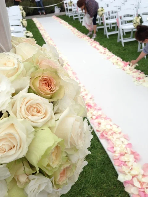 Almost done. Laying down the rose petals. One hundred roses where used.