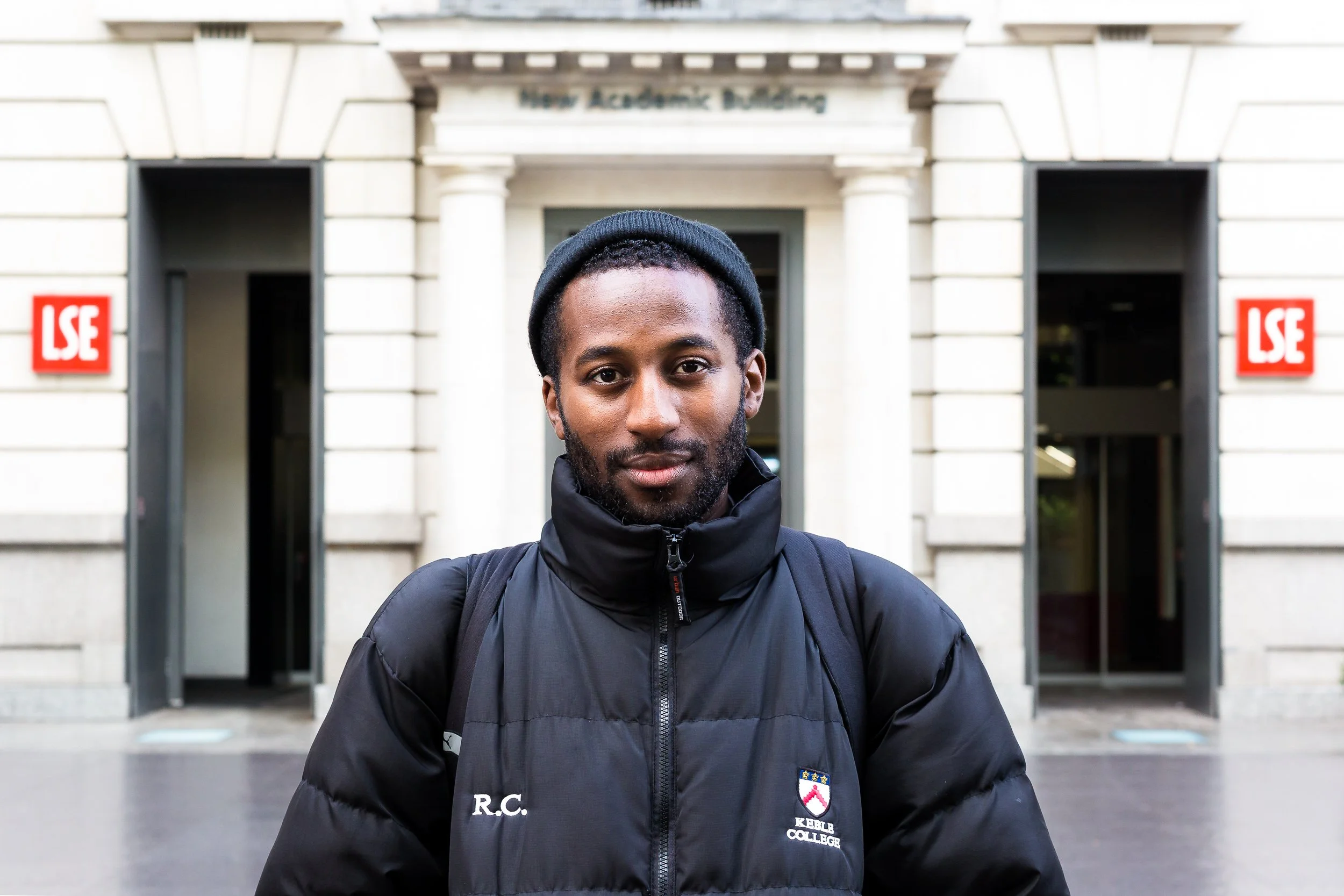 Portrait of a student standing in front of the LSE