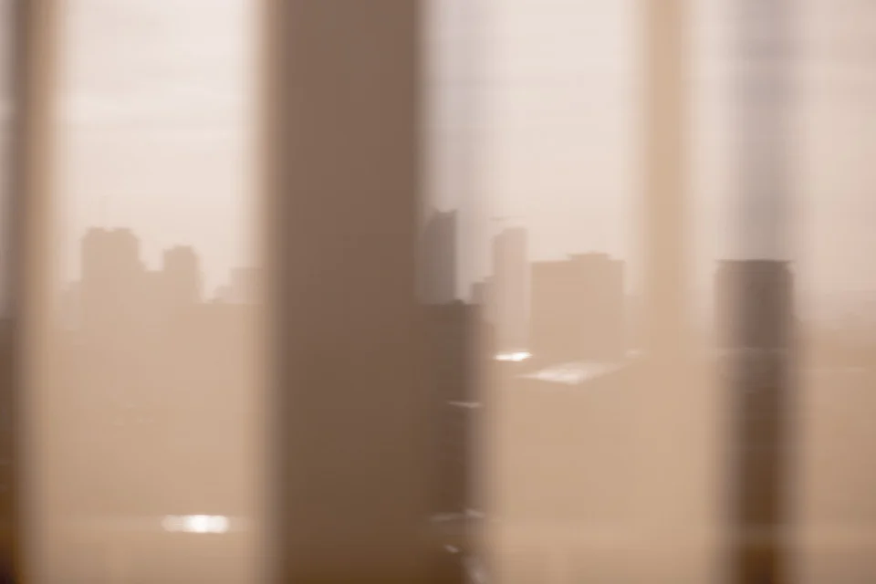 London, in between corporate portraits. The 'razor' building can be seen (centre) through curtains. 
