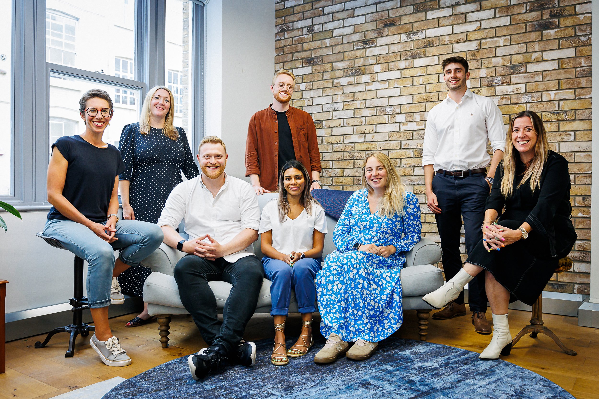 Group photo in an open plan office