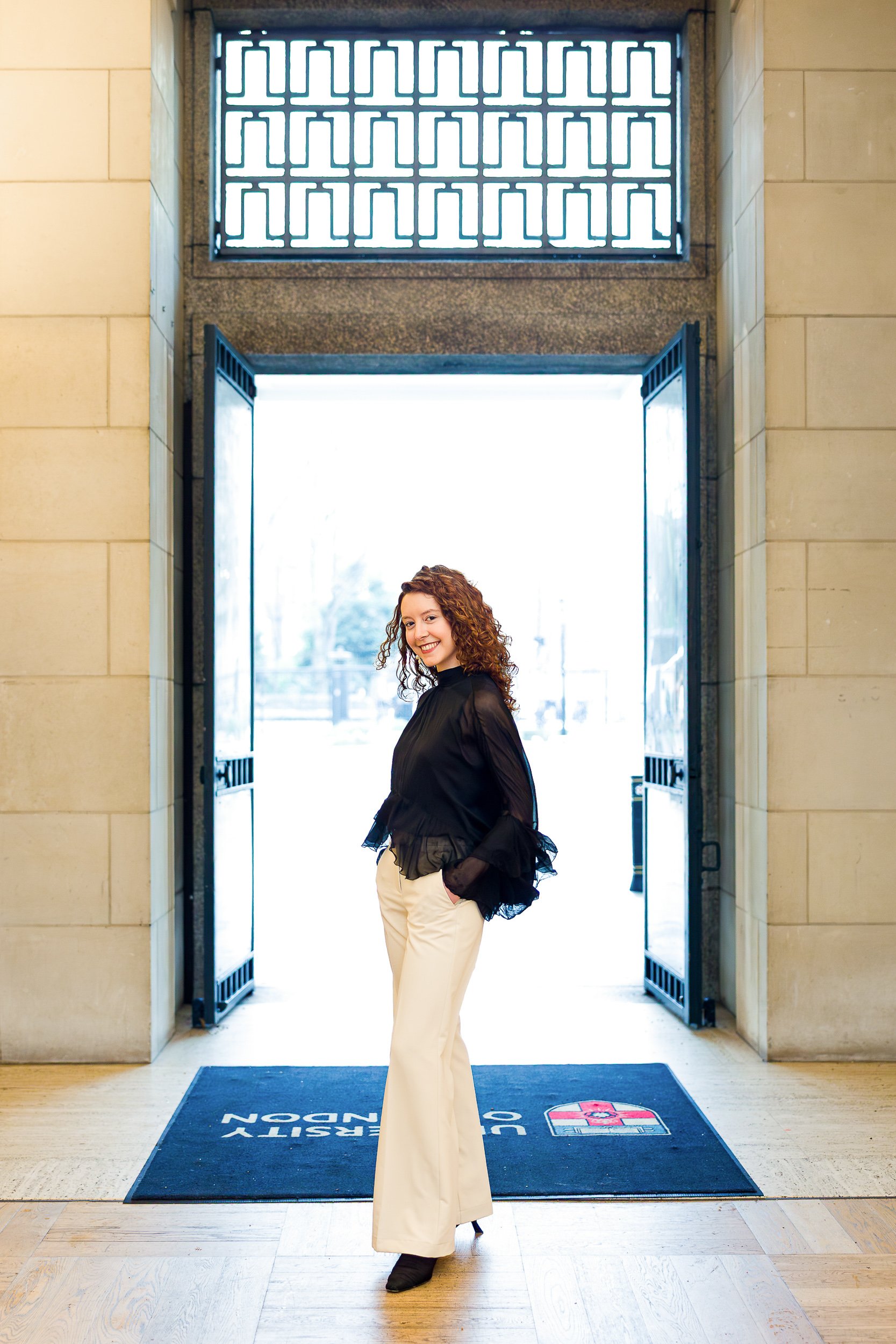Portrait of a young graduate at the entrance of Senate House, University of London