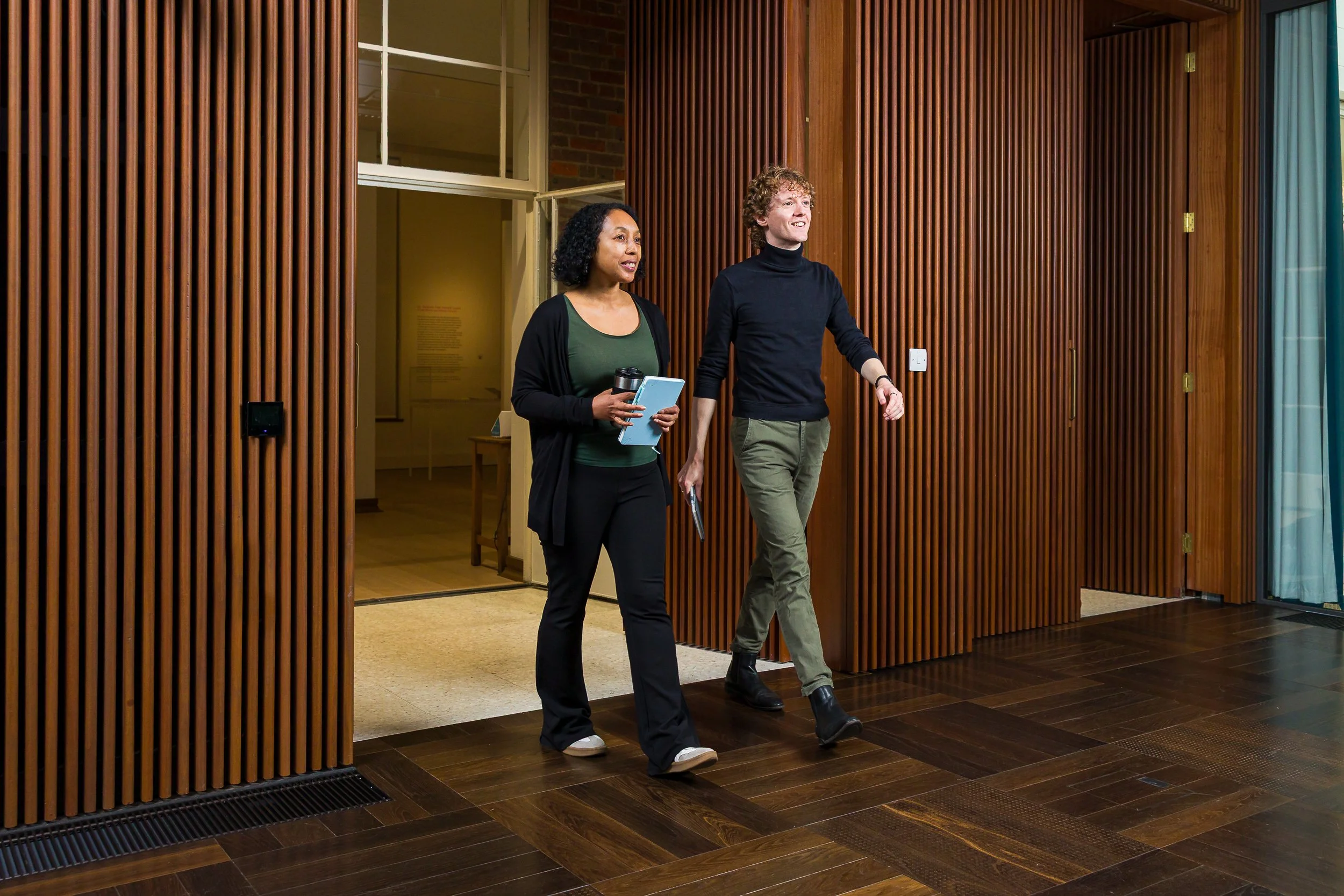 Two students walk into a lecture hall