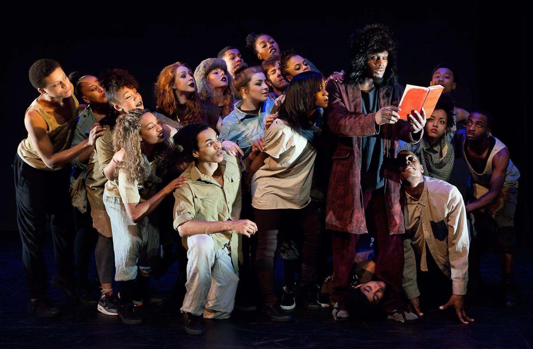 Dancers try to glimpse content of book