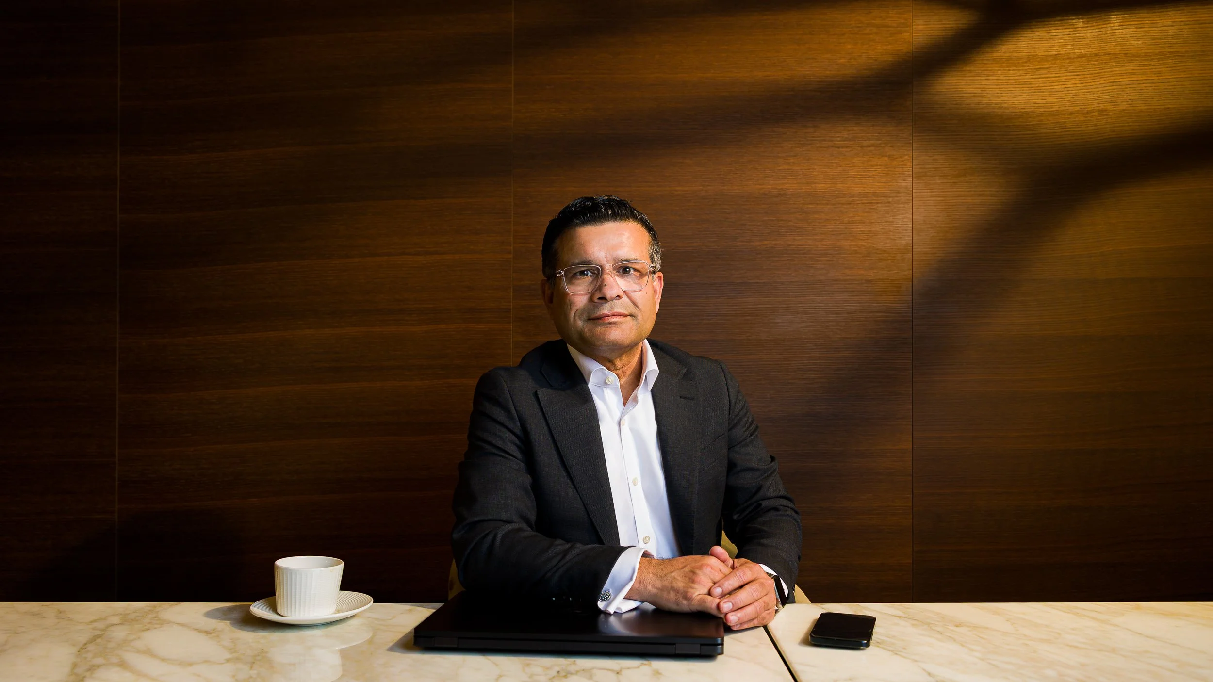 Portrait of a man at a table in a meeting room