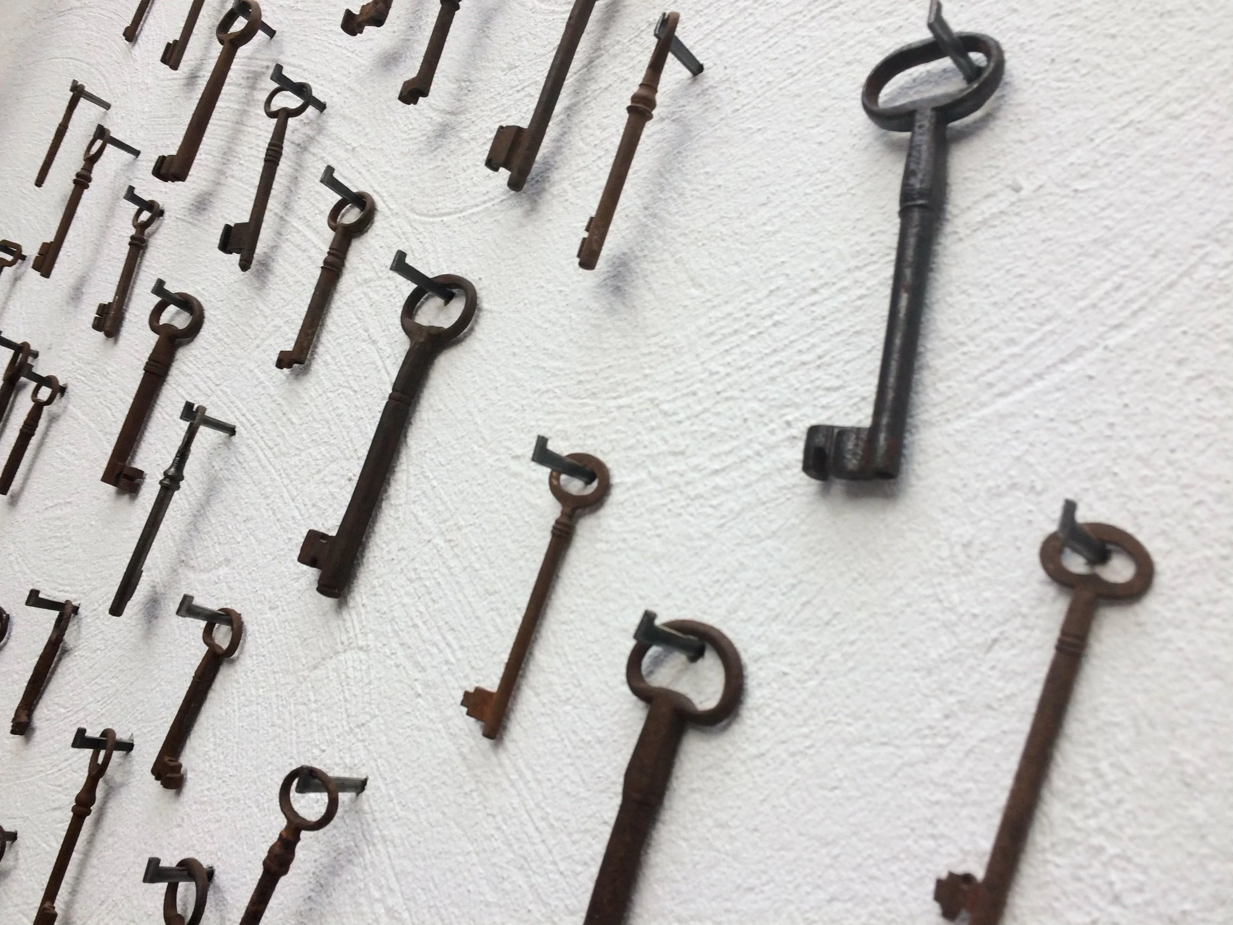 keys on a wall at an angle