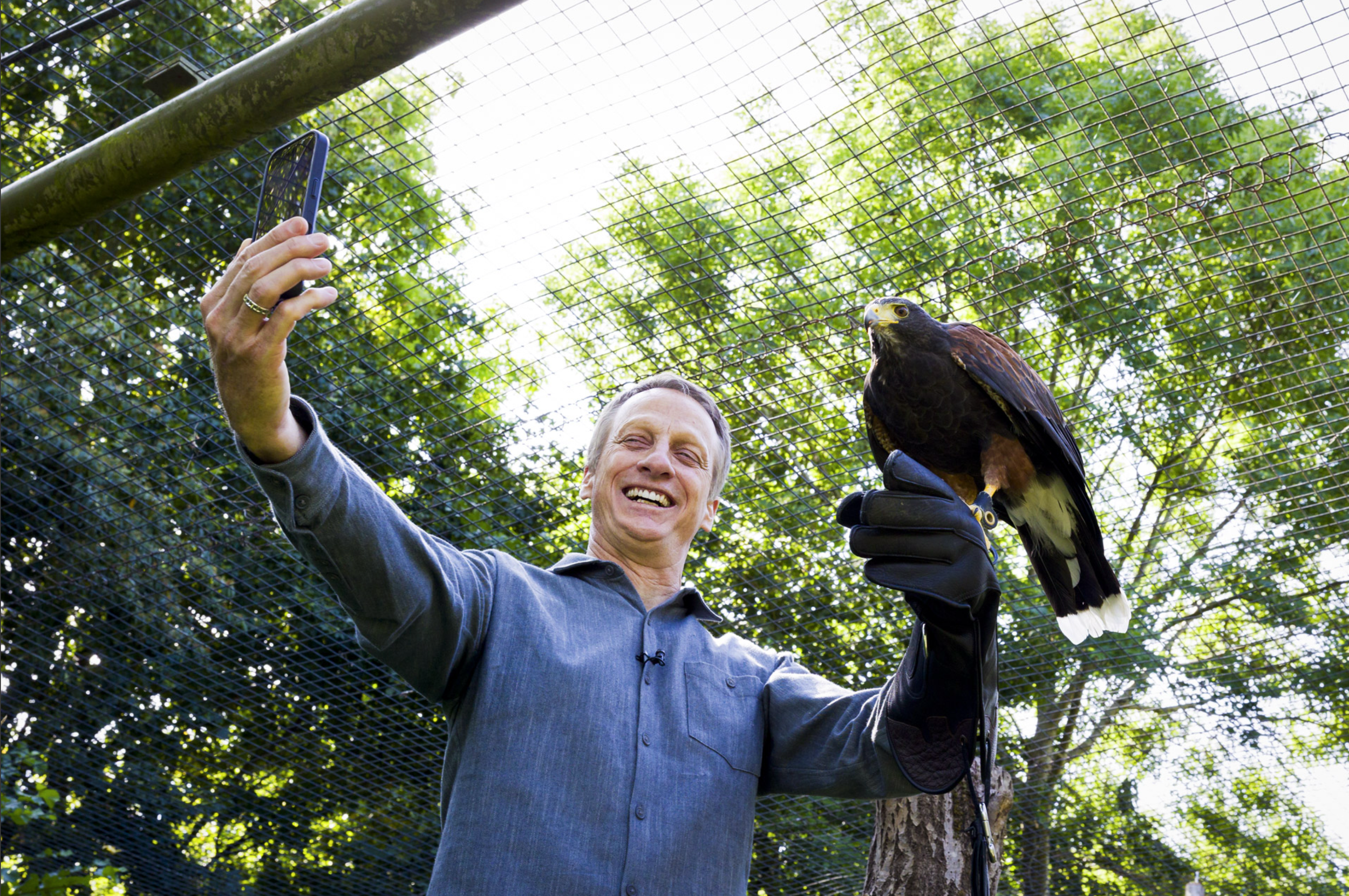 Skateboarder Tony Hawk with a hawk