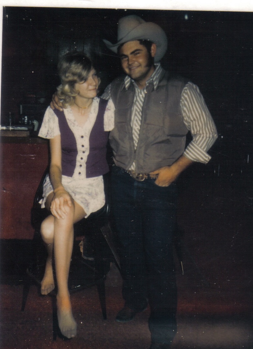  My favorite picture of my parents. This was taken in the bar where they met. Probably about 1974. I've always wondered why mom doesn't have on any shoes. Must have been quite an evening. 