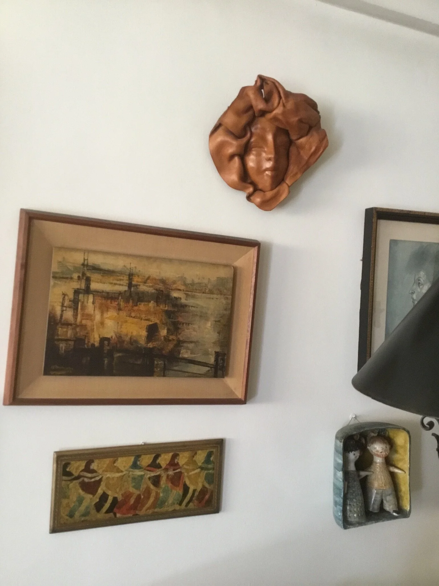 Leather mask, oil painting, Picasso print and ceramic couple