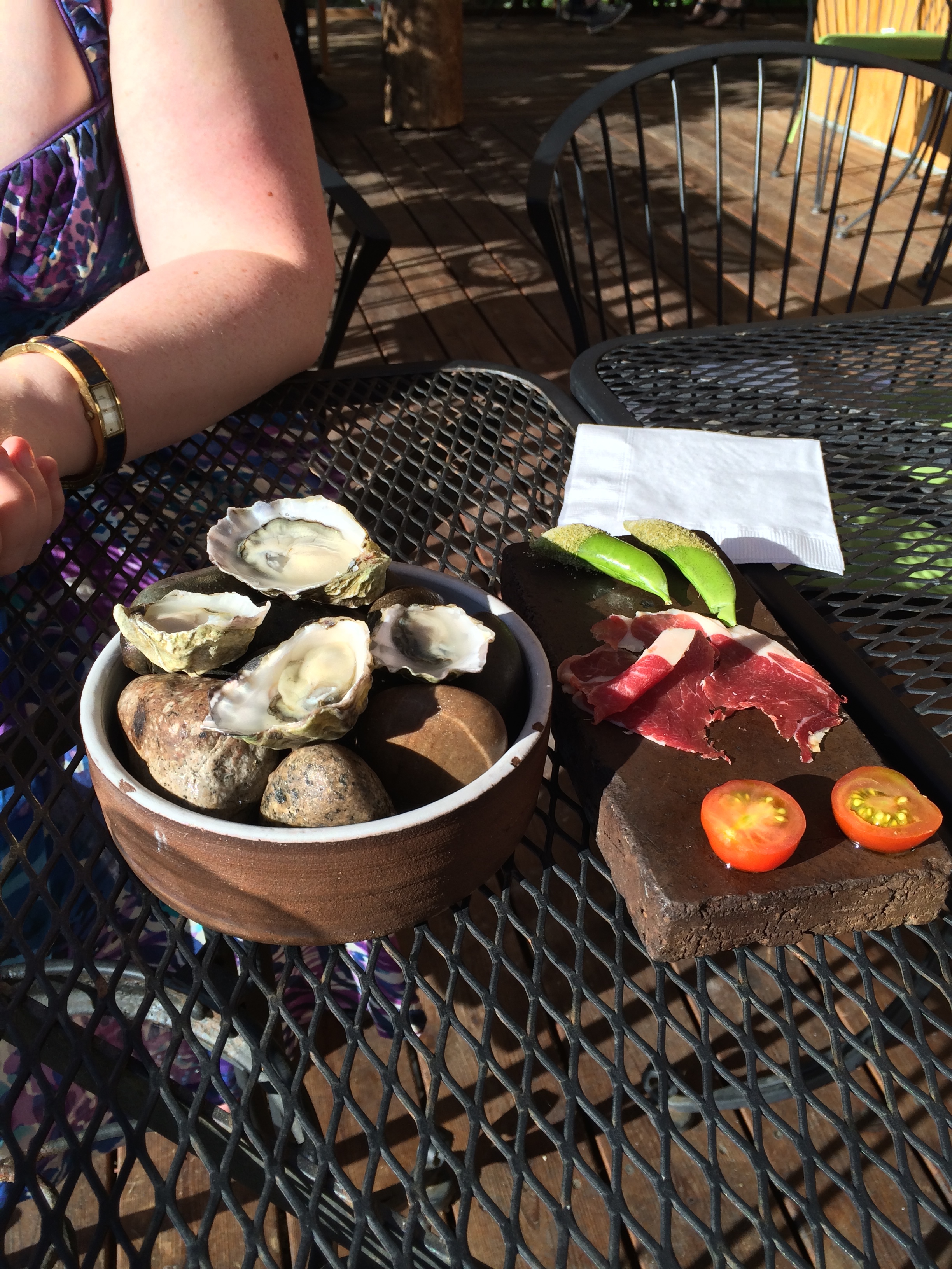 Oysters from Samish Bay, peas with some sort of dust, lamb proscuitto and cherry tomatoes.