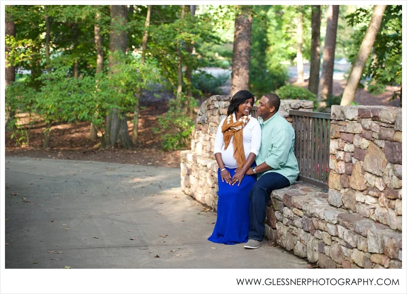 Expectant parents Kamisha and Adrian pose for their maternity portraits taken by High Point-based family photographer Glessner Photography at Tanger Family Bicentennial Gardens in Greensboro.