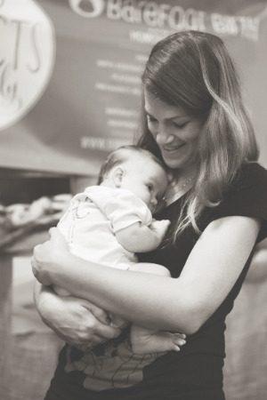 Homeborn baby Jaxon gets all the Mary Catherine Cuddles while his mama Melissa meets potential clients at the Natural Birth and Baby Expo this Spring