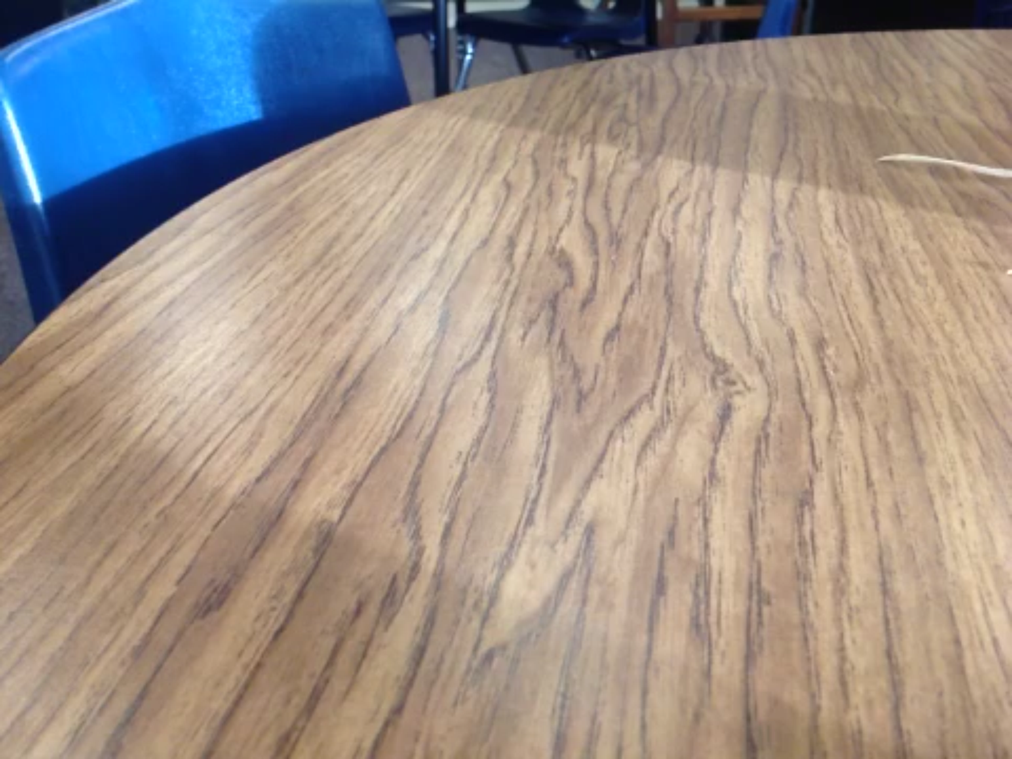 Smaller resolution, yet larger viewable area. Note that you can see the chair in this picture. 