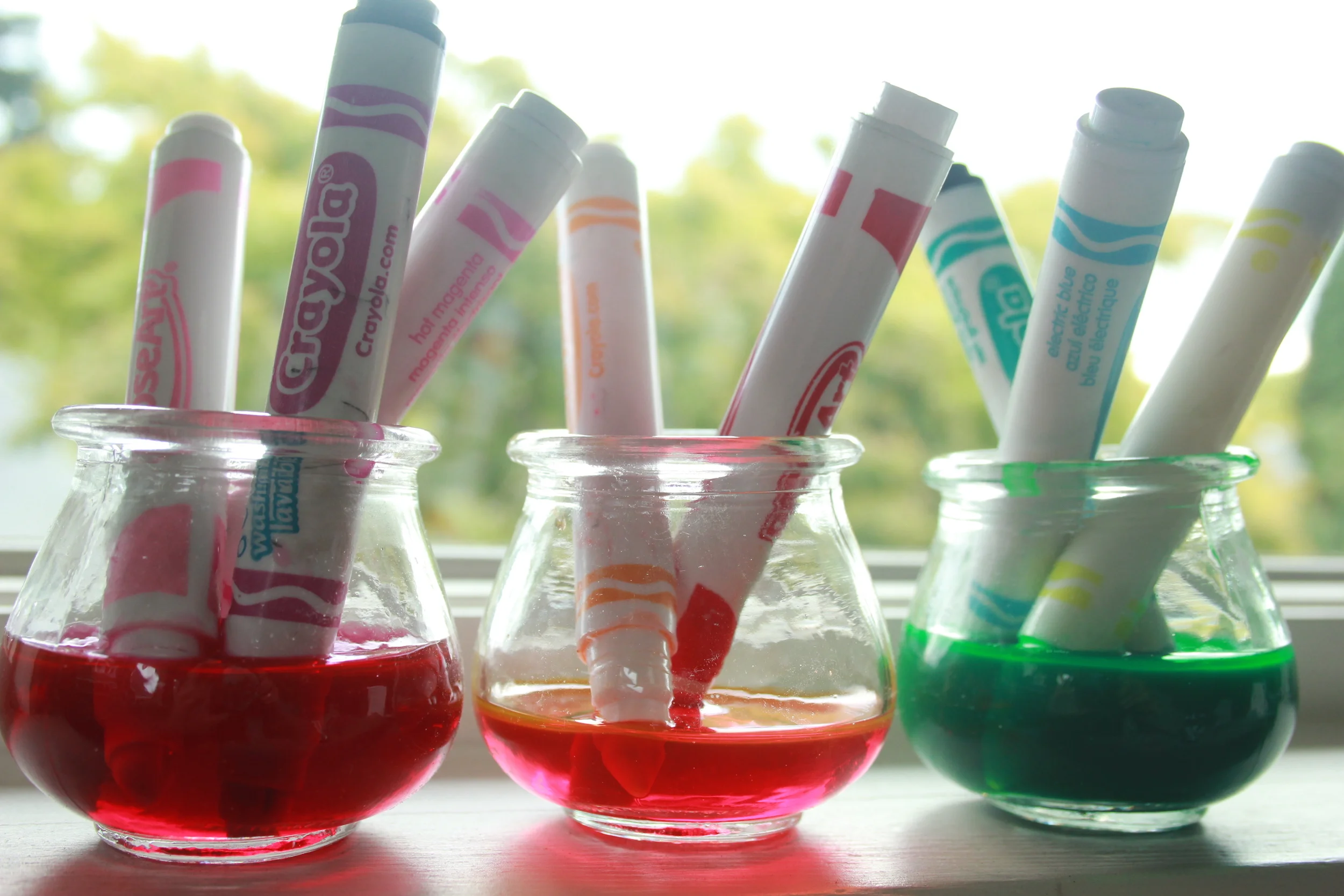 Place your marker experiment in a window for a few hours to watch the light shine through as the colors swirl into the water. Any combination of colors will produce a cool result. The longer you leave them in the more saturated your mixes will be. 