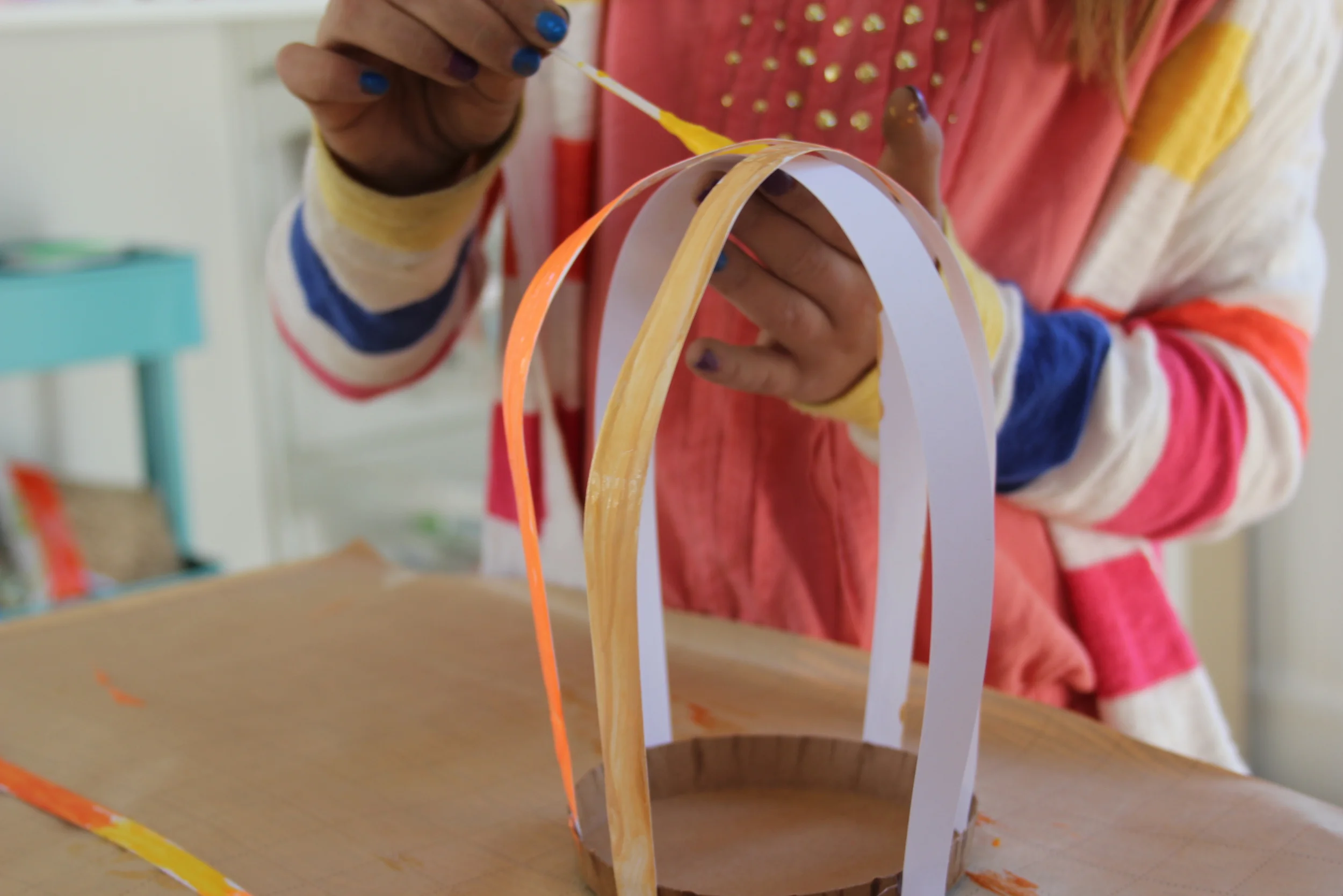 Hot glue the paper strips to the base or large card stock strip. Paint the small strips.