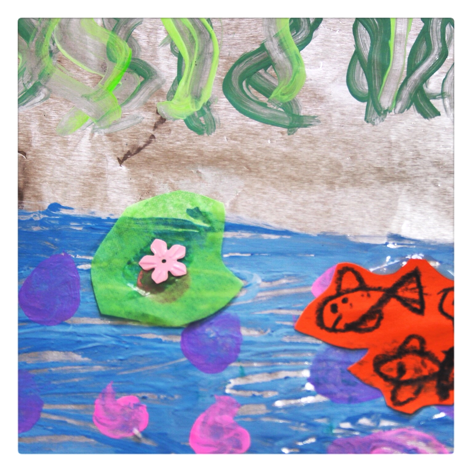 Tinfoil, paint,sparkling lilies and golden fishes, you can almost imagine yourself in the middle of Monet's garden in Giverny.......almost.