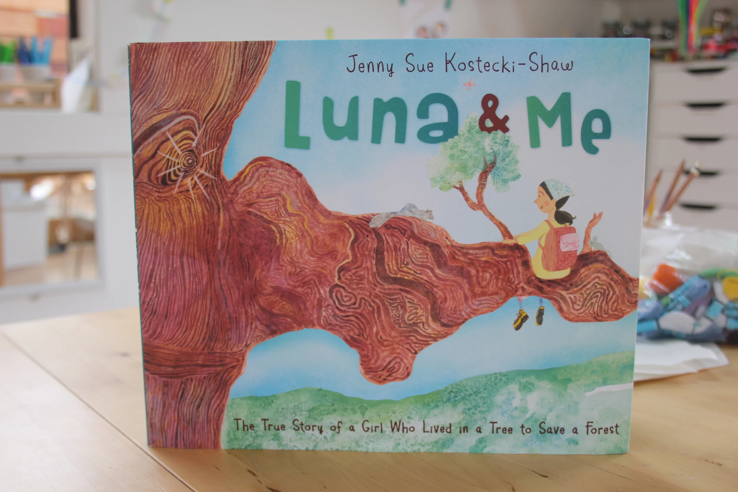 Find the shade of a big tree and read Luna & Me. Luna lived in a Redwood tree for almost two years to prevent it from being cut down. Now, that's what I call a Nature Girl.