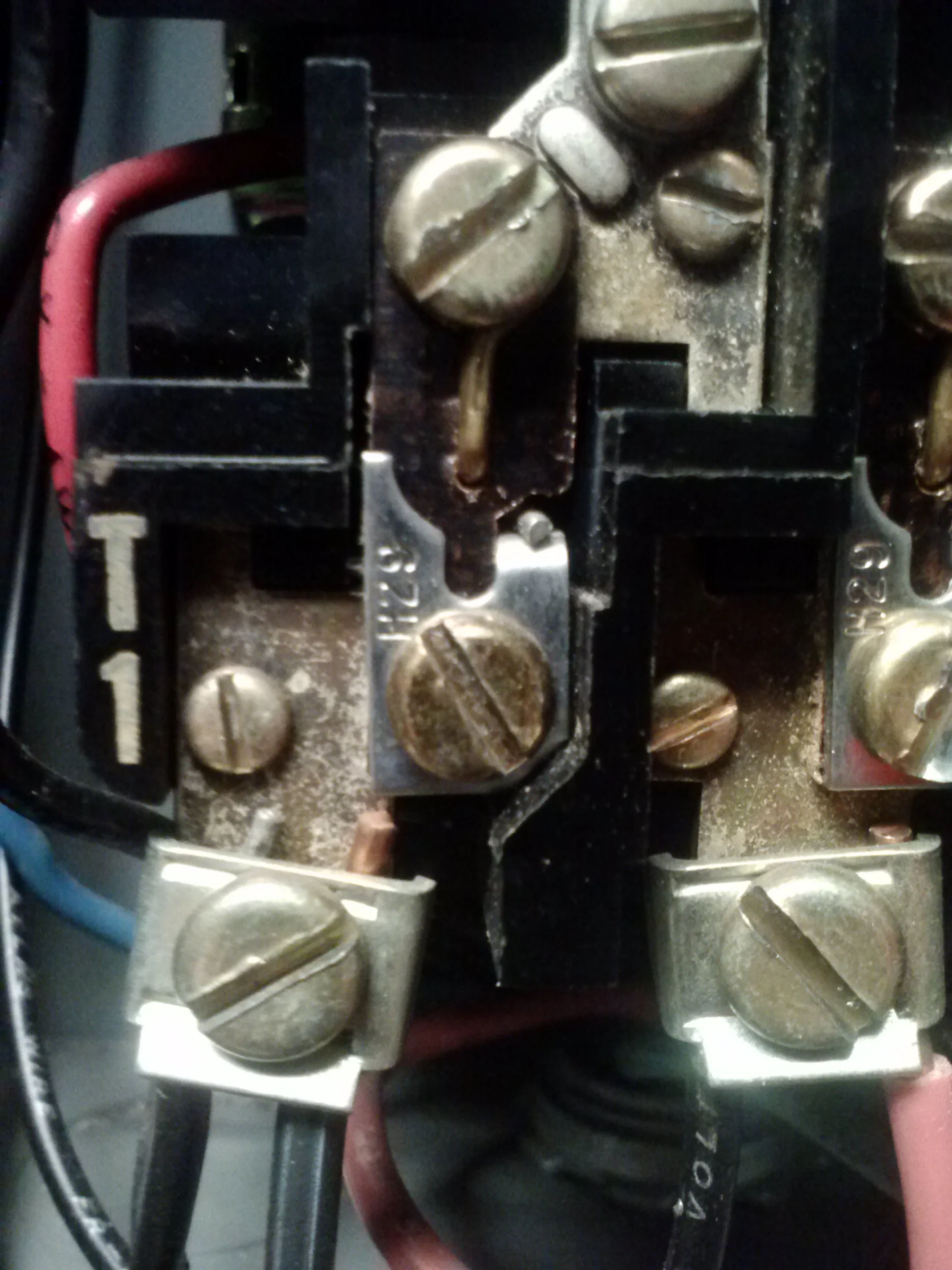 Part III. This is the overload protection "heater" on top of the motor starter. This heater is selected from a chart under the motor controller cover. You can see it is a called an H29.