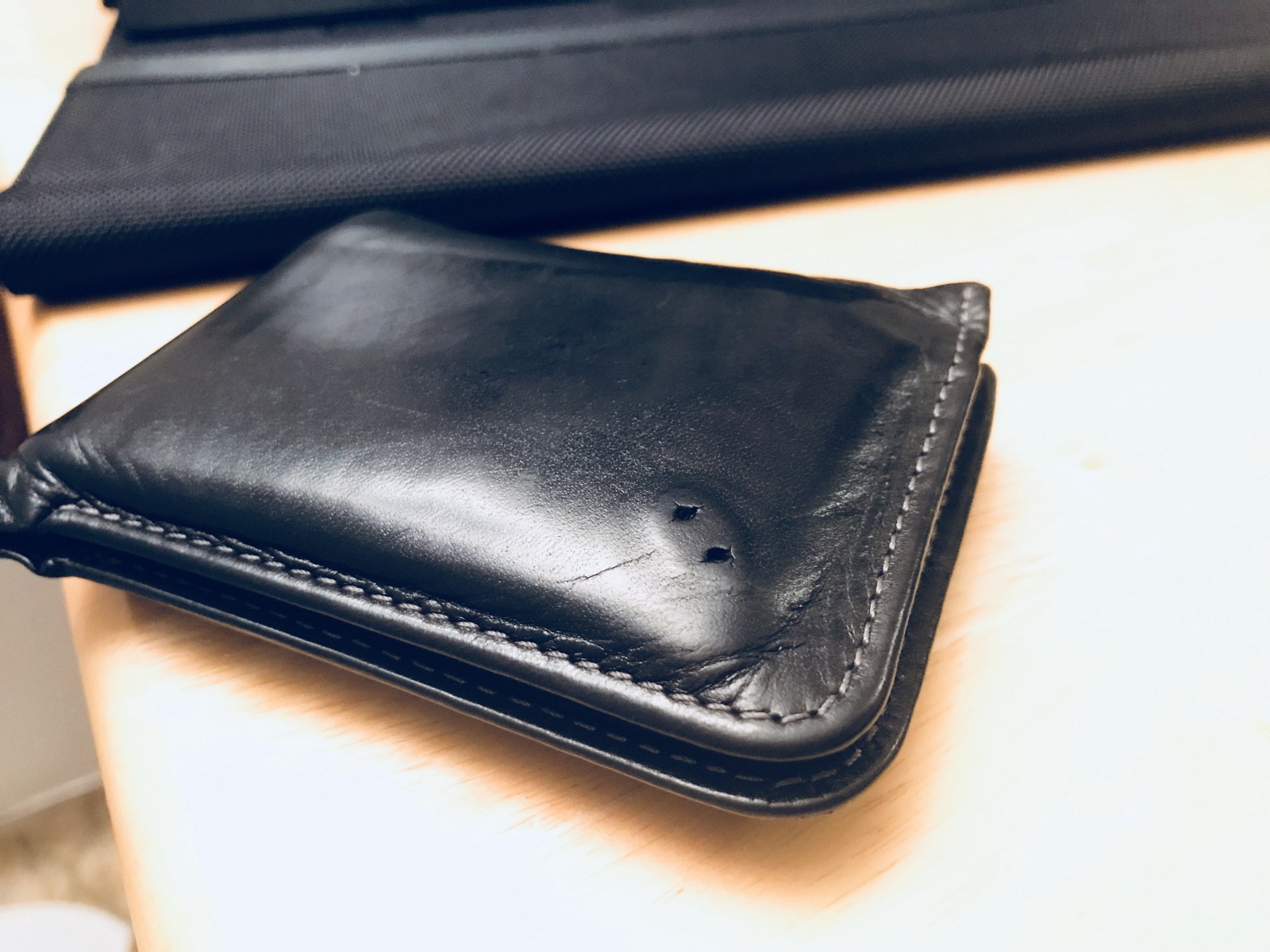 The wallet logo was missing. It’s likely because it got caught in the pockets very often.