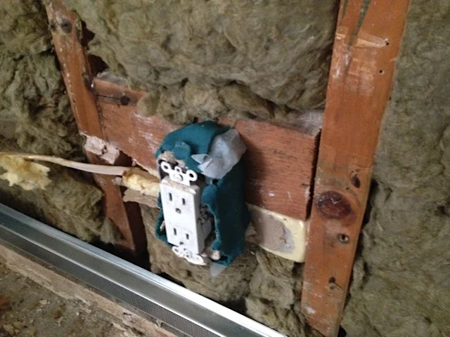 QuietPutty behind the electrical outlets. Interestingly, the neighbor had no electrical outlets on his side.