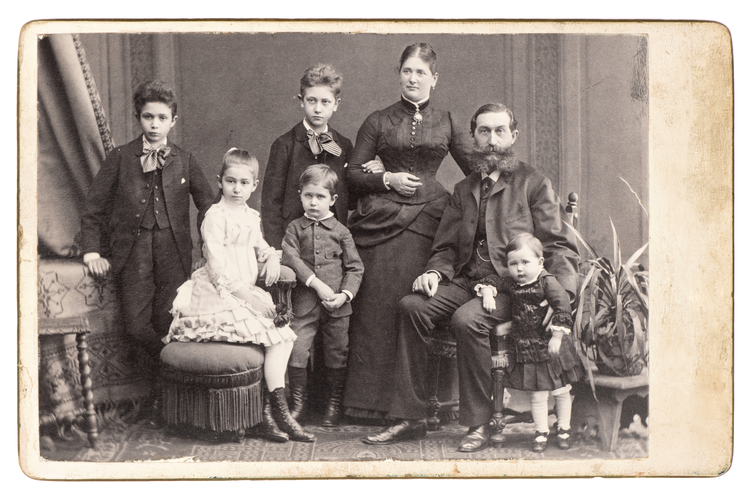 old family photo. parents with five children