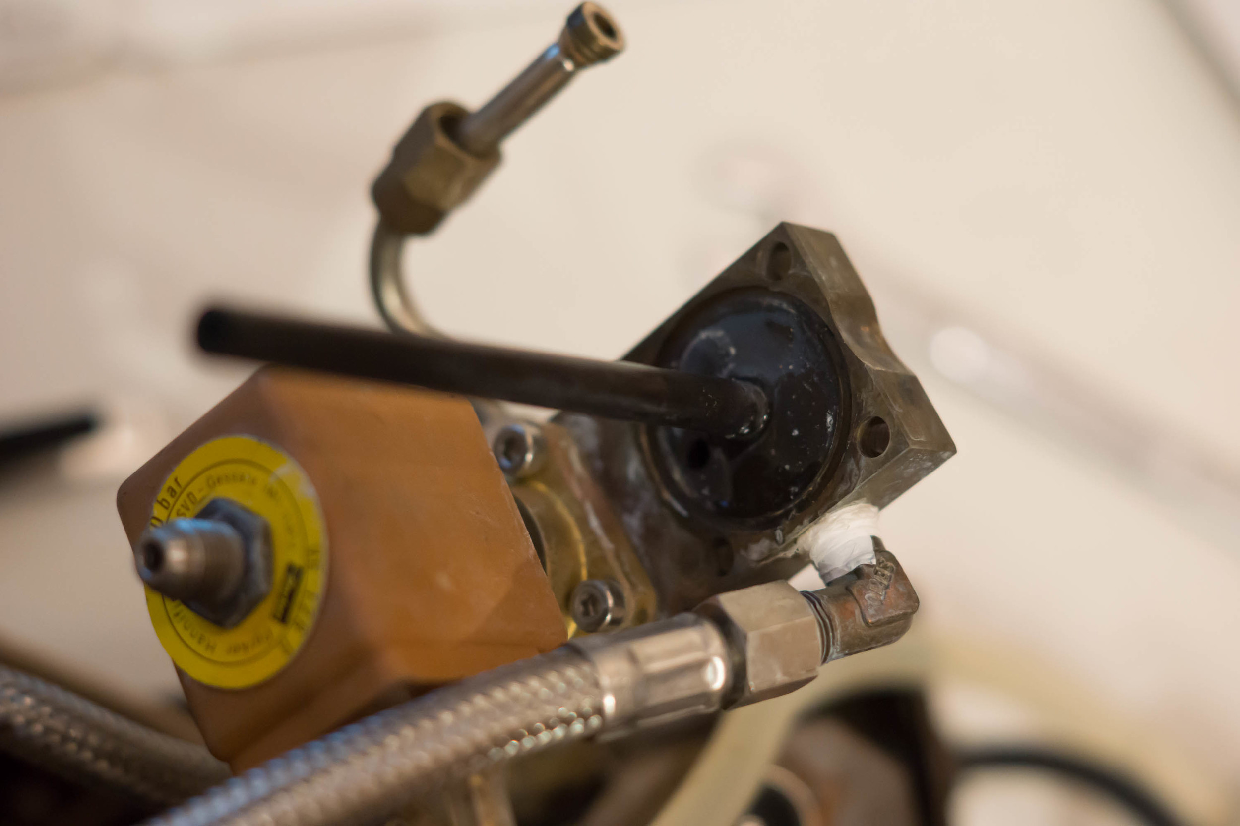 5. Fit the new gasket into the depression on the block and return it to its original position on the boiler. If your backflow drainage hose came undone like mine be sure to reattach it.