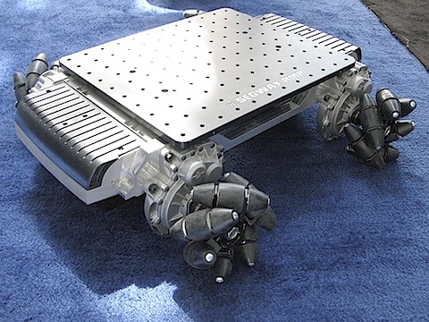 These omnidirectional wheels that I came across on this robot have apparently been around for more than 35 years. Seeing them in action is totally awesome. They allow the vehicle to move in any direction even sideways. Sideways motion is achieved by counterrotating the front and rear wheels. Check out the video of the robot below and a very cool forklift using the same technology over here .
Via Make