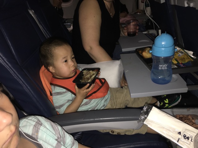 Joshua likes penne so much, he ate it right out of the container. Hooray airplane food. 