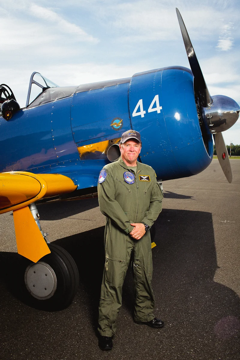 Jeff Geer stands in front of the WWII era AT-6.